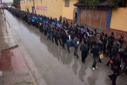 Masked Mayan Indians, members of the Zapatista National Liberation Army (EZLN), march in San Cristobal de las Casas, Chiapas state, Mexico, Friday, Dec. 21, 2012. Organizers said some 12,000 people marched in the cities of Ocosingo, Palenque and San Cristobal de las Casas. The marches marked the Dec. 22 killing of 45 indigenous Zapatista backers by a rival armed local group. They also marked the conclusion of a 5,125-year cycle in the Mayan calendar. (AP Photo/Ivan Castaneira)
